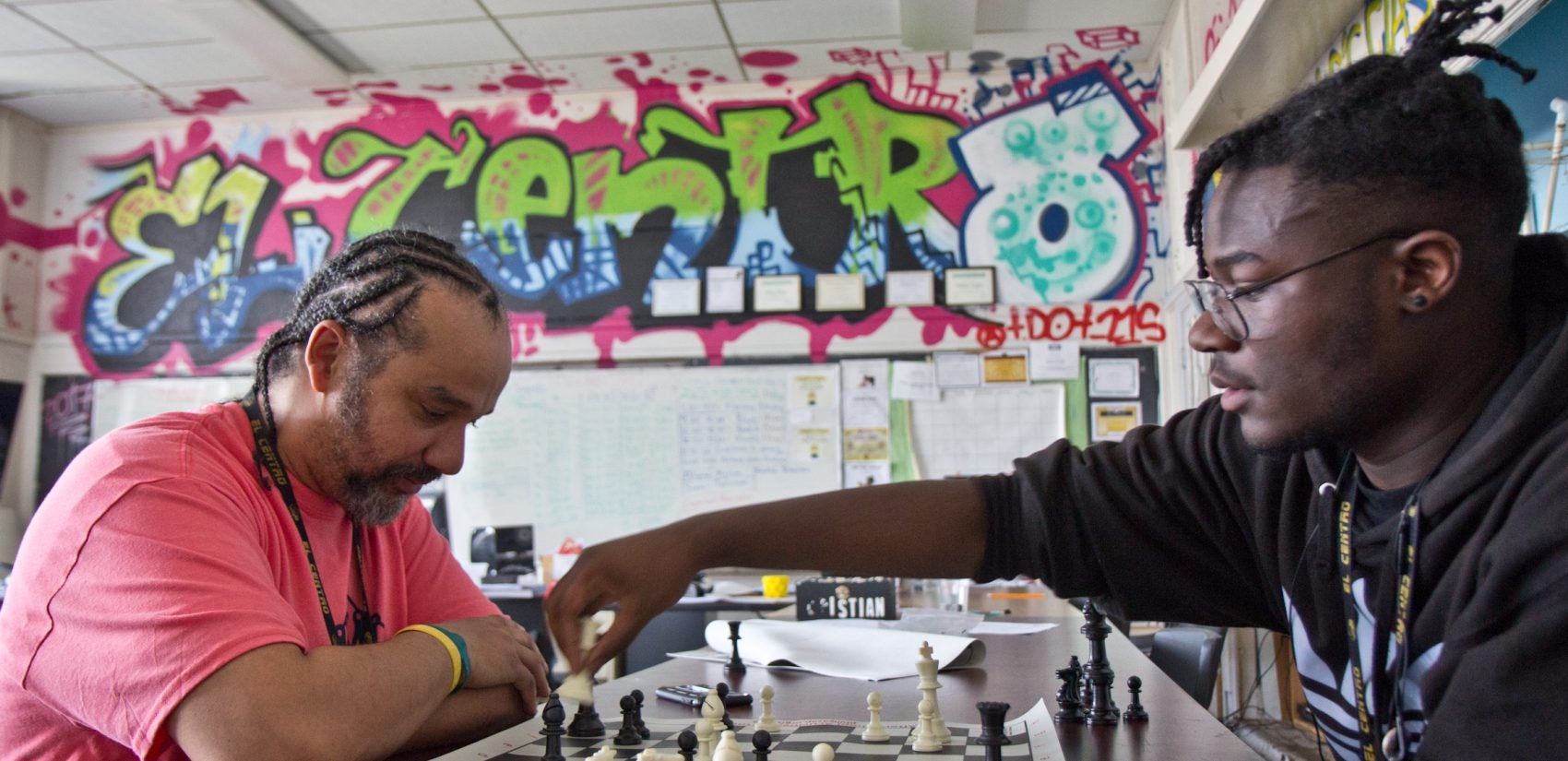 Doug Cox (left) teaches mathematics and engineering at El Centro. He also leads the Dark Knights chess club. (Kimberly Paynter/Keystone Crossroads)