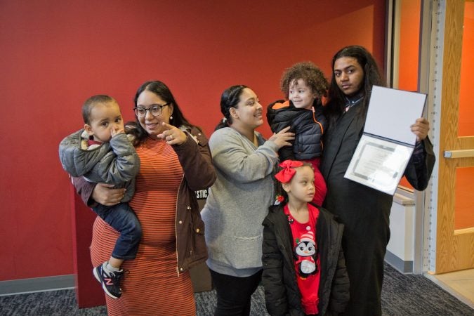 Joshua Martinez with his niece and nephews, along with his sisters Arianna, and Melinda (left). (Kimberly Paynter/Keystone Crossroads)