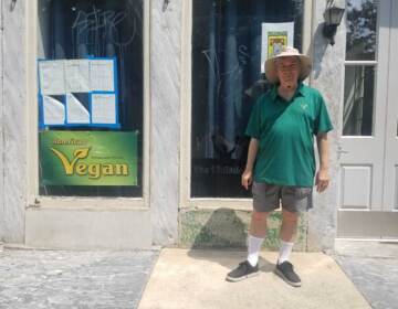 Vance Lehmkuhl stands outside the American Vegan Society space on 2nd Street