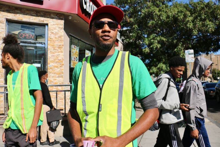 Paul T. Jackson, 34, works with Frontline Dads patrolling the area around Broad and Susquehanna at dismissal time to look out for potential violence. His own experience with stop and frisk makes him think it is not a good idea. (Emma Lee/WHYY)