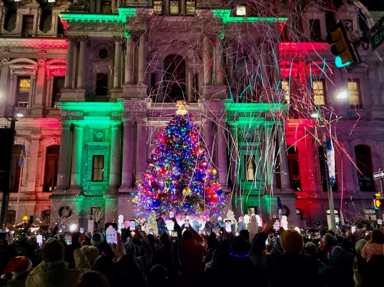 A Christmas tree is lit outside Philadelphia City Hall