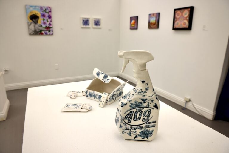 Two porcelain sculptures, one of a 409 spray bottle