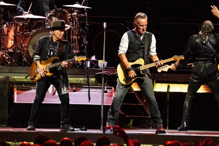 Nils Lofgren and Bruce Springsteen perfrom