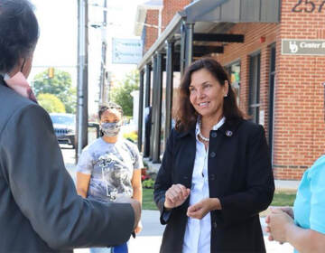 Kathy McGuiness speaking with people