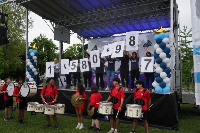 Drummers and people holding numbered signs at Delco Gives Day