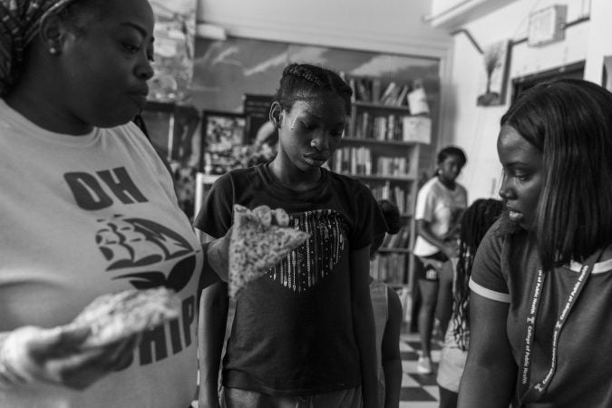 Kareema Hardy (left), Cheryl's daughter, grew up coming to Gathers. She's a mom of three and has been helping run the day camp for 16 years. (Jessica Kourkounis for Keystone Crossroads)