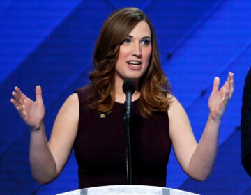 Sarah McBride speaking at a podium