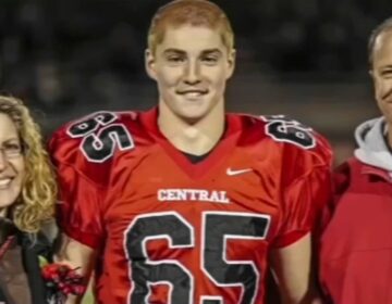 Timothy Piazza is seen with his parents in a file photo