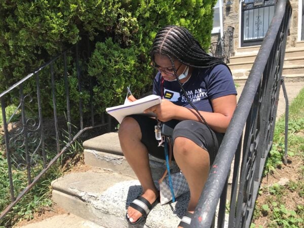 As a coping mechanism, Aliah sometimes writes a note to herself and tosses the paper in nearby Tacony Creek. (Avi Wolfman-Arent/Keystone Crossroads)