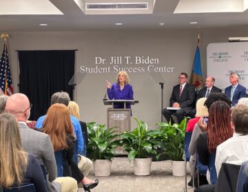 Jill Biden speaks behind a podium