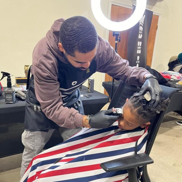Adam Fair giving a haircut