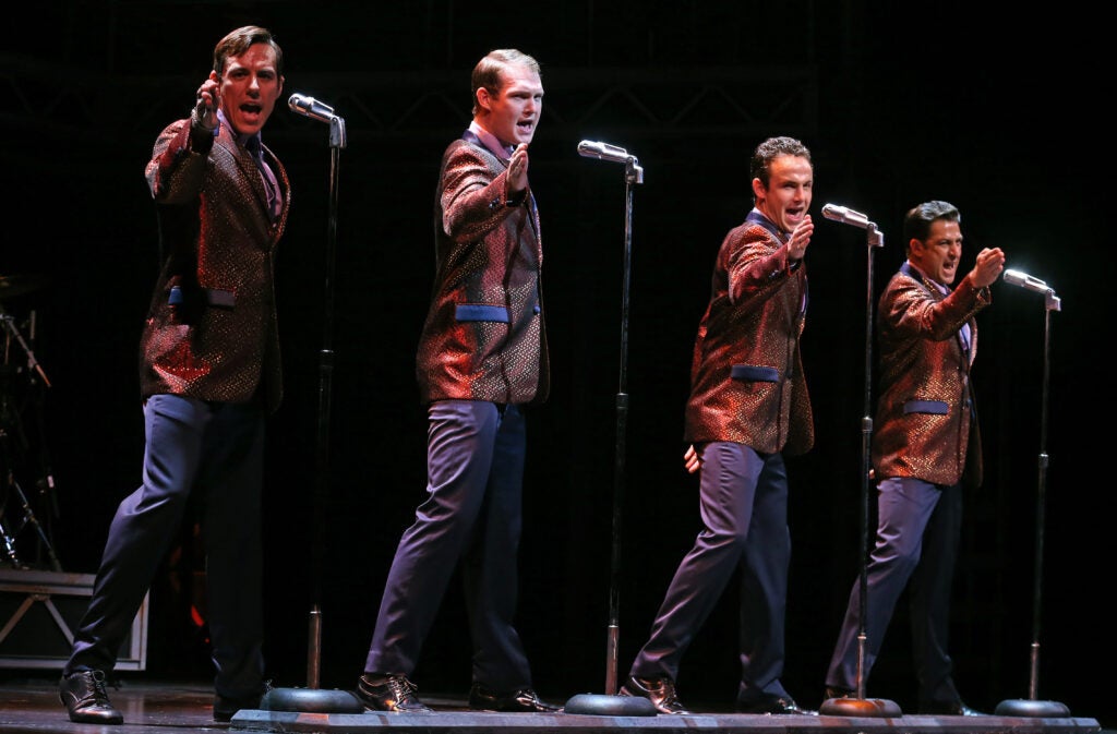 Four actors sing