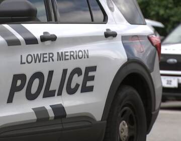 A police car reads Lower Merion Police.