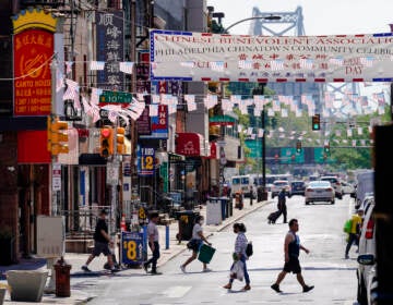 Pedestrians walk in Philadelphia's Chinatown