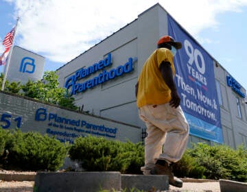 A person walks past Planned Parenthood