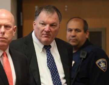 Rex Heuermann, center, charged in the Gilgo Beach serial killings on Long Island, appears for a hearing, Tuesday, July 30, 2024, at Suffolk County Court in Riverhead, N.Y.