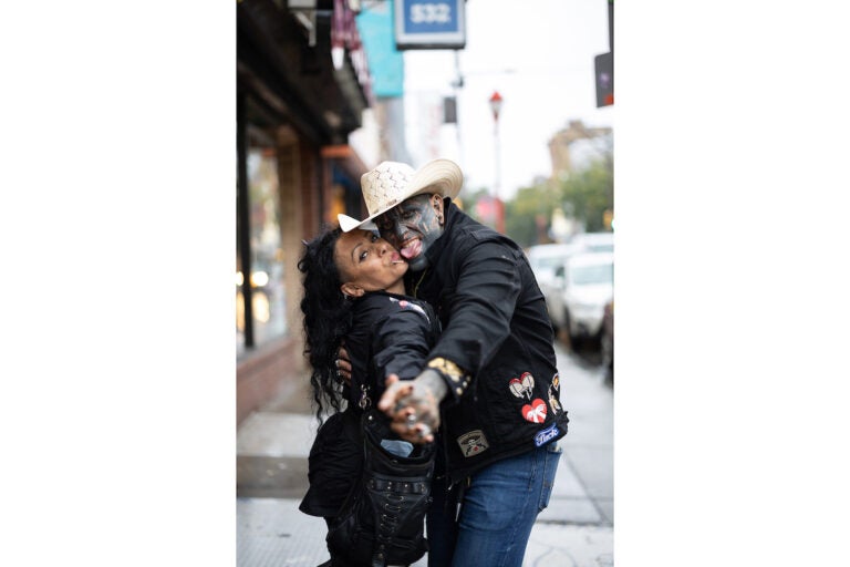 Two people pose for a photo while dancing