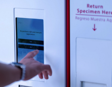 Someone using a kiosk